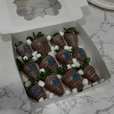 Chocolate covered strawberries with blue drizzle