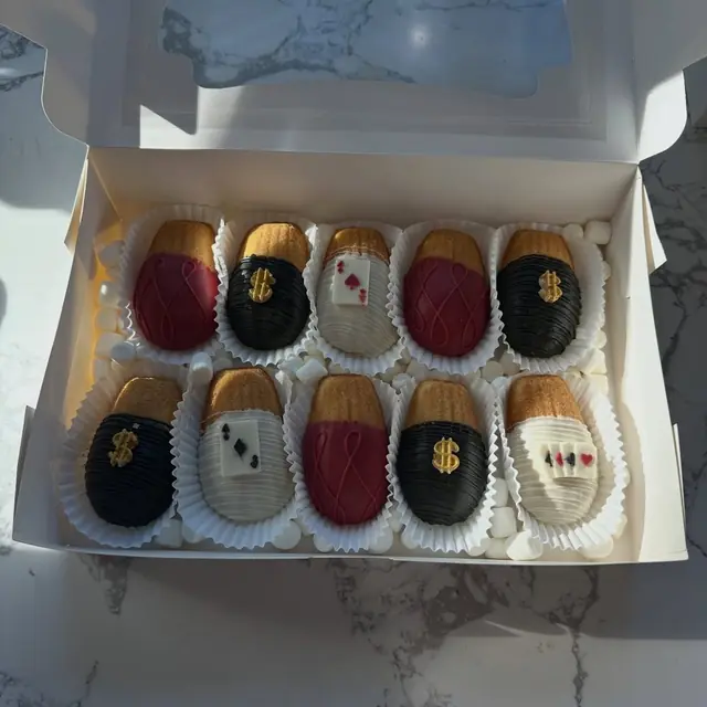 Dark and white chocolate strawberries finished in gold