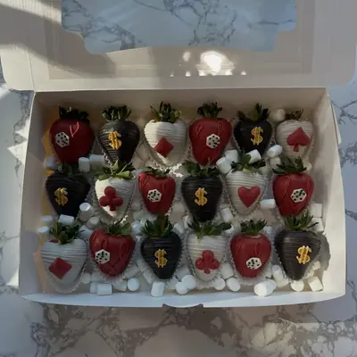Chocolate covered strawberries decorated for a casino theme