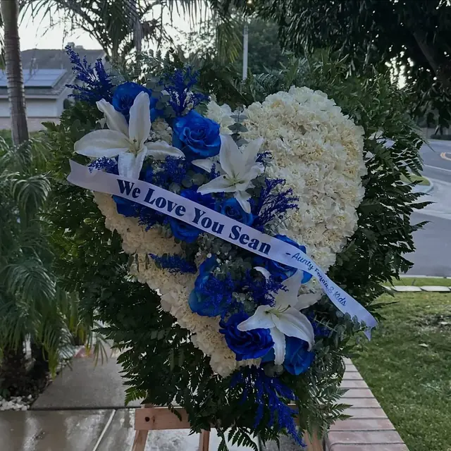 Blue and white standing sympathy arrangement