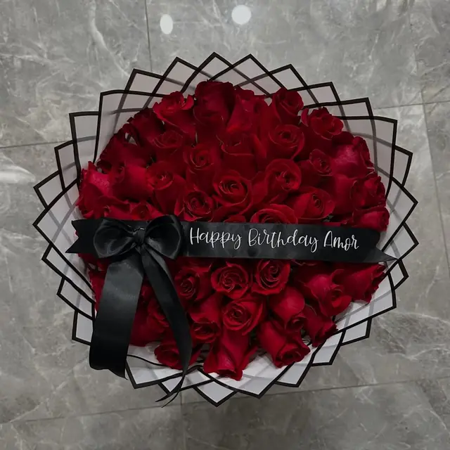 Red rose heart wrapped in a black lattice rim